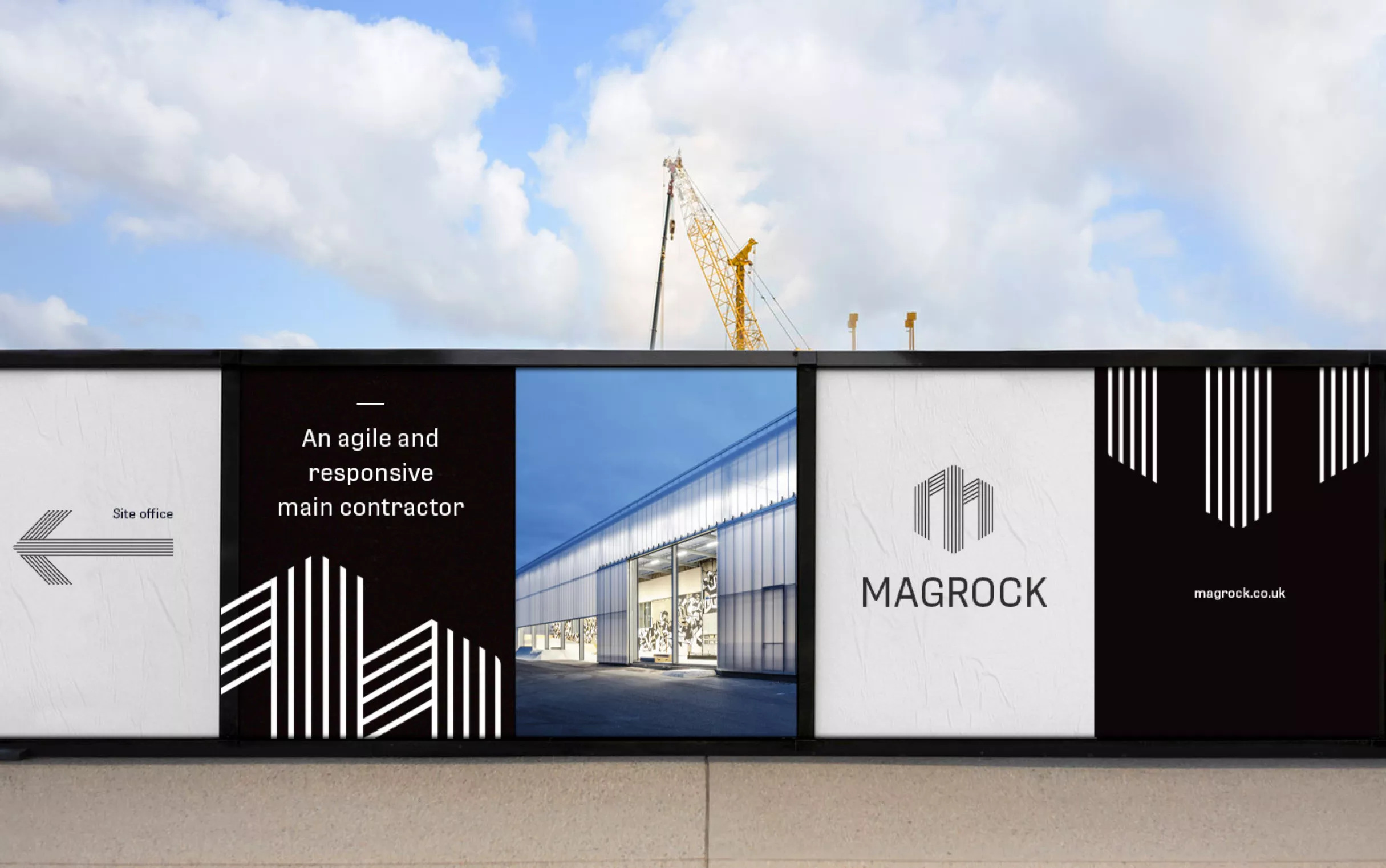 Construction site safety fence with black and white Magrock branding