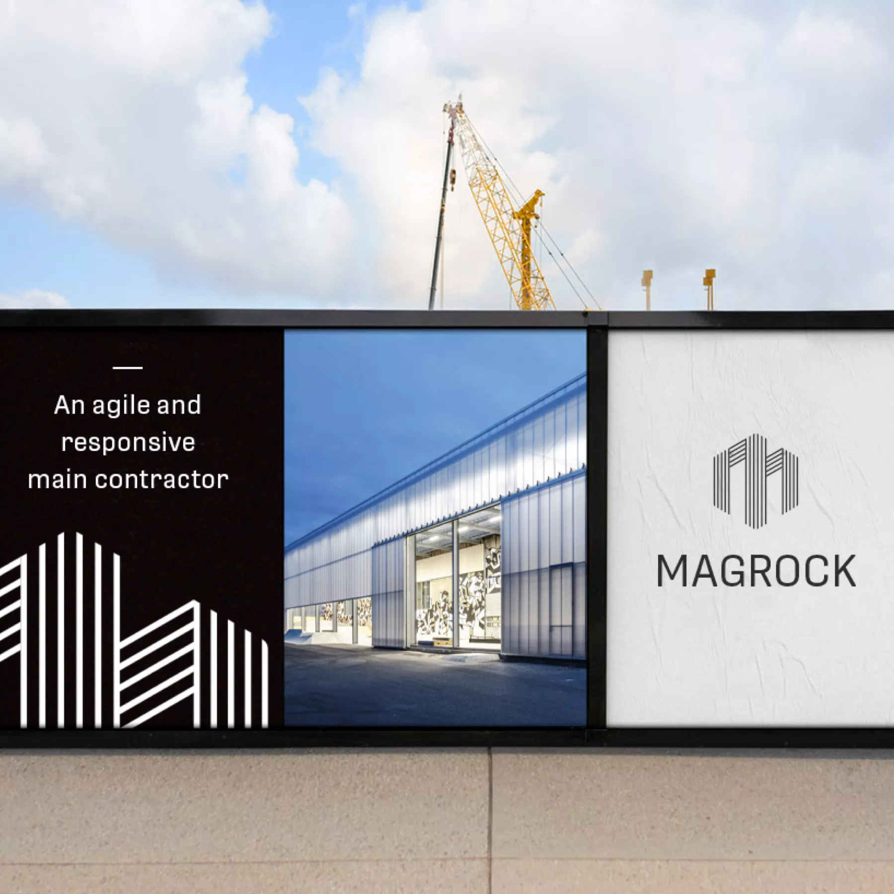 Construction site safety fence with black and white Magrock branding