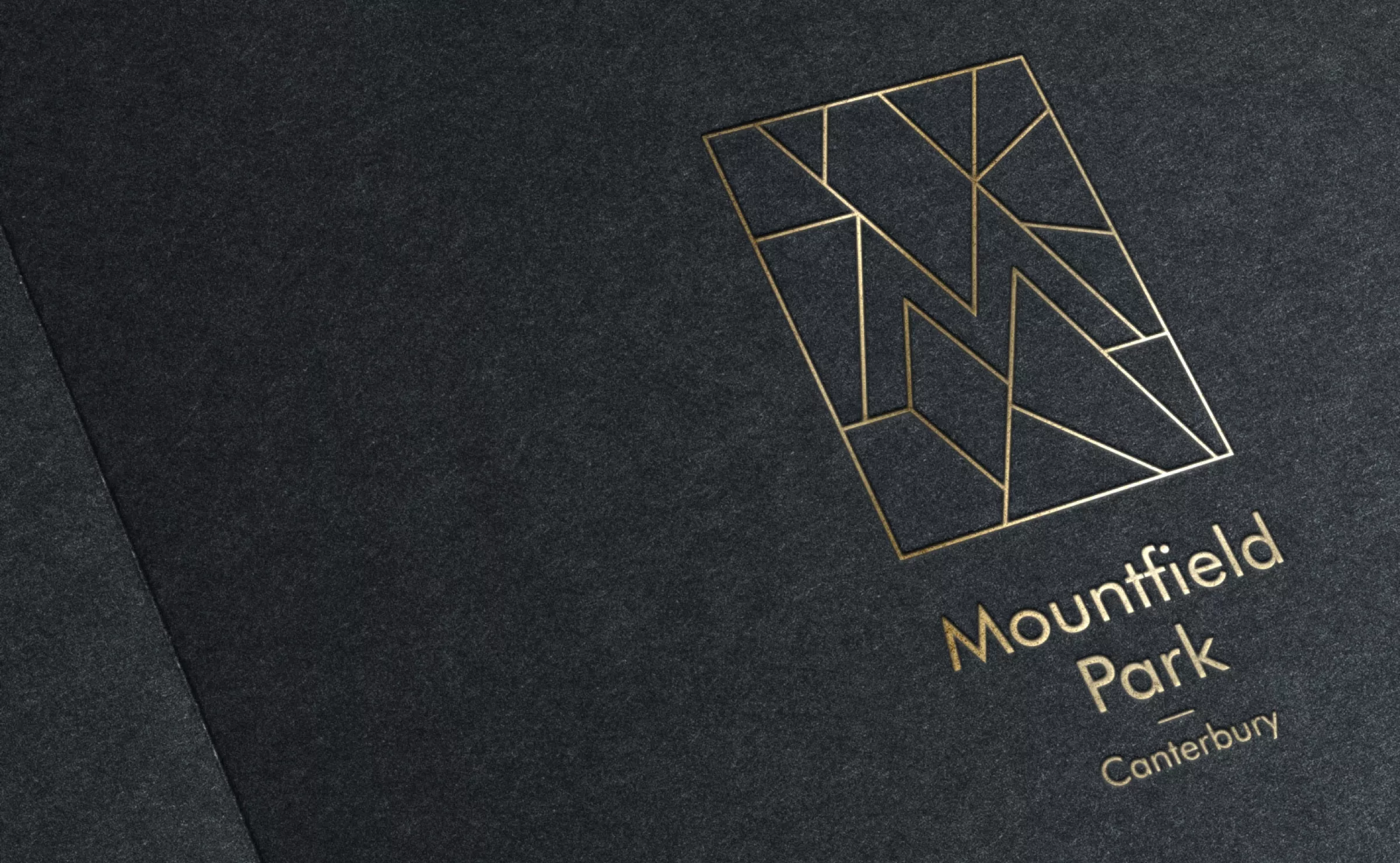 Gold Mountfield Park logo on a black background