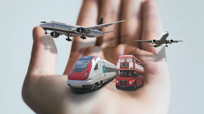 Two planes, a bus and a train in the palm of a hand