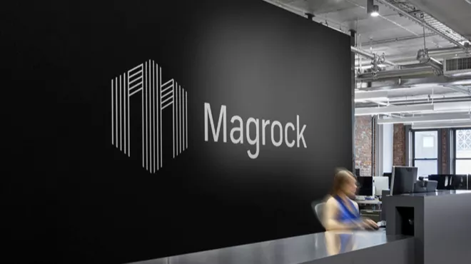 Magrock reception area with the magrock logo behind the desk
